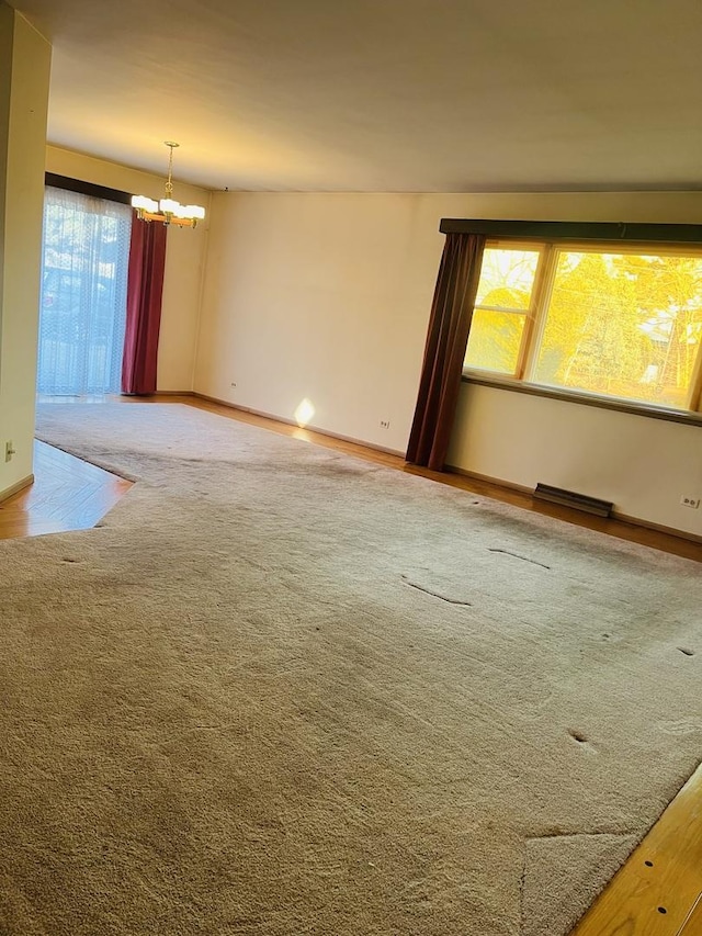 empty room with an inviting chandelier