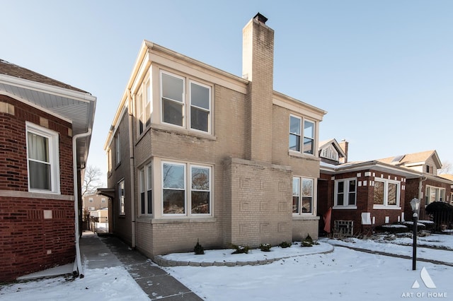 view of snow covered house