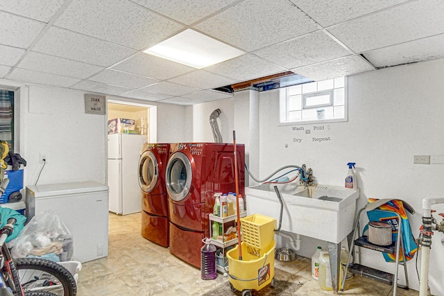 clothes washing area with washer and dryer