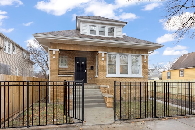 bungalow-style house with a front lawn and covered porch