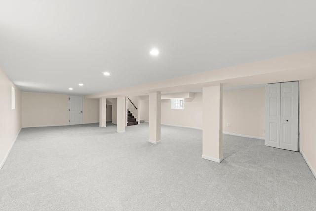 basement with light colored carpet