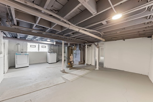 basement featuring separate washer and dryer and gas water heater