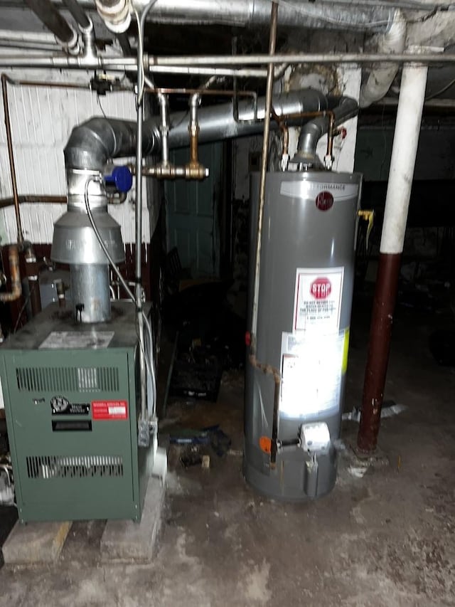 utility room featuring water heater