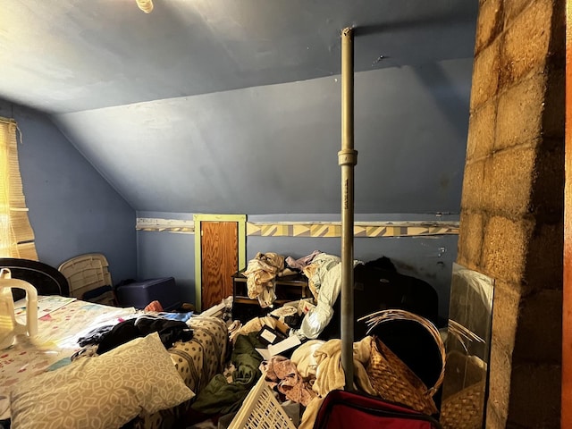 bedroom featuring vaulted ceiling