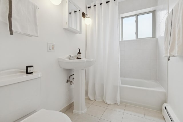 bathroom featuring toilet, a baseboard heating unit, tile patterned floors, and shower / bath combo with shower curtain