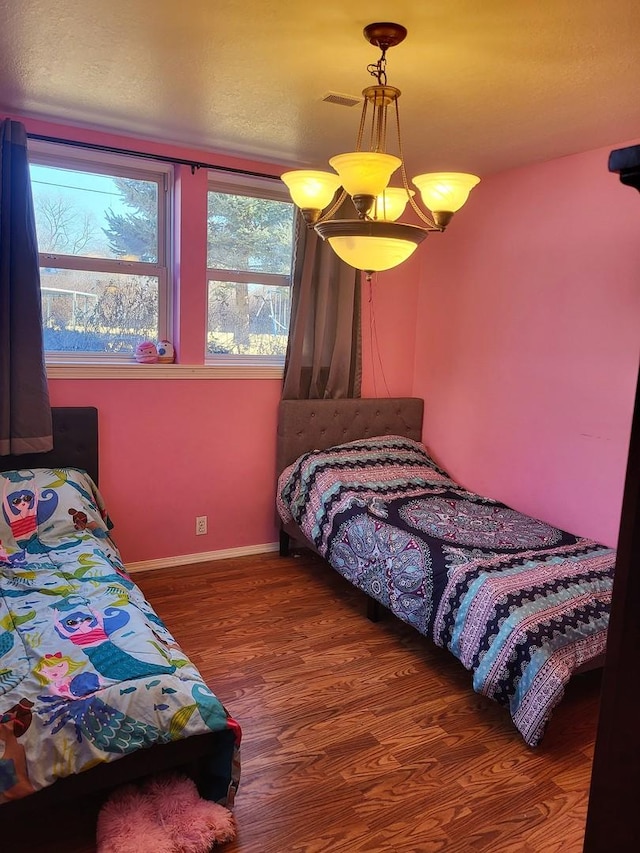 bedroom with dark hardwood / wood-style floors