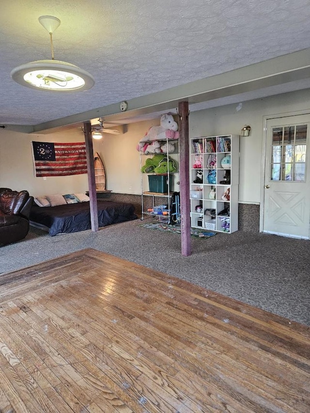 interior space with carpet floors and a textured ceiling