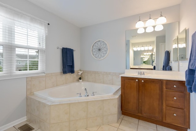 bathroom featuring vanity, tiled tub, and tile patterned floors