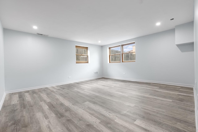 spare room with light hardwood / wood-style flooring