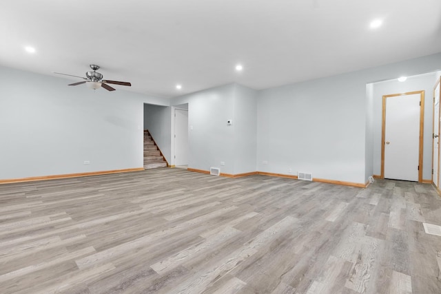 unfurnished living room with light hardwood / wood-style floors and ceiling fan