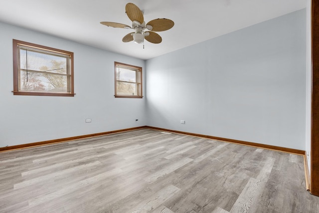 empty room featuring light hardwood / wood-style flooring and ceiling fan