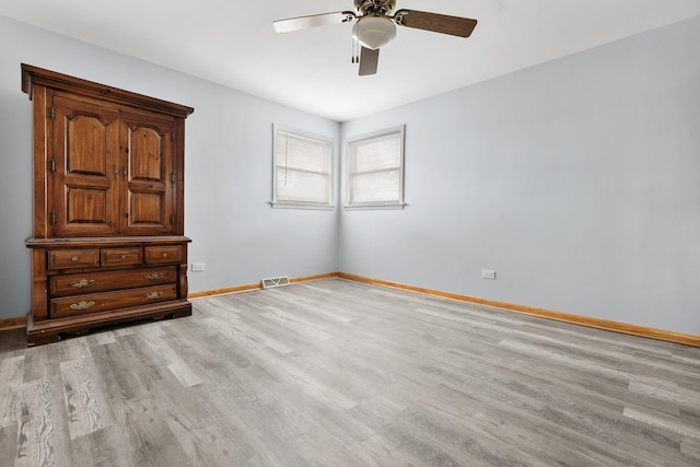 unfurnished bedroom with ceiling fan and light hardwood / wood-style floors