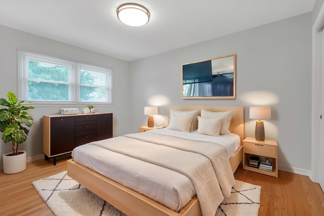 bedroom with light wood-type flooring