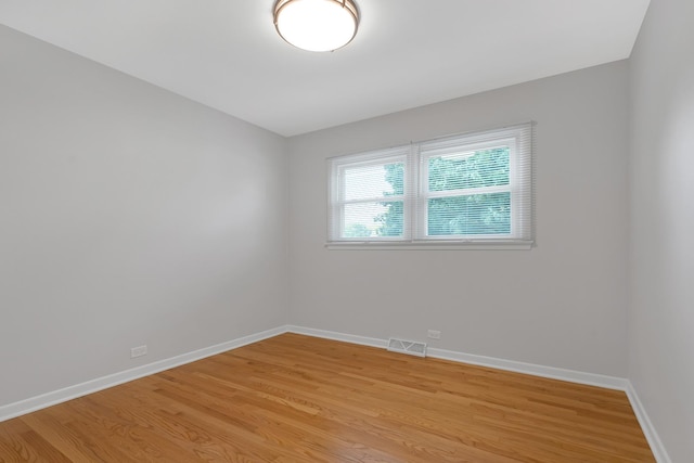 spare room featuring light hardwood / wood-style flooring