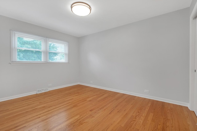 unfurnished room with light hardwood / wood-style floors