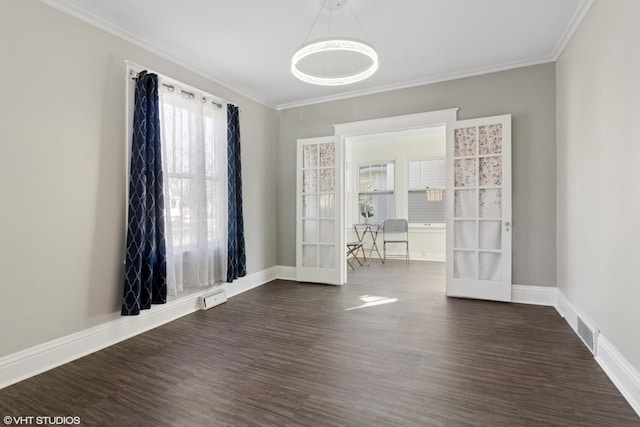 unfurnished room with dark wood-style floors, french doors, crown molding, and baseboards