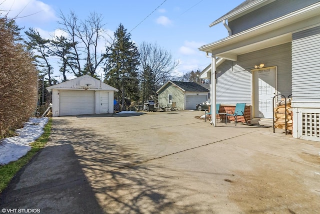 view of yard with an outbuilding, a garage, and entry steps