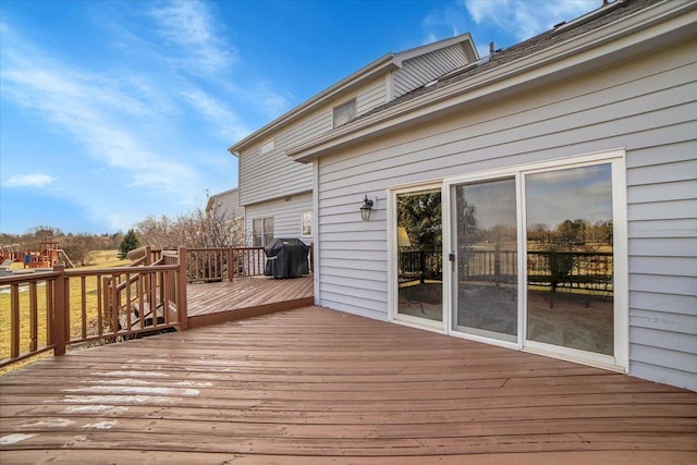 wooden deck featuring grilling area