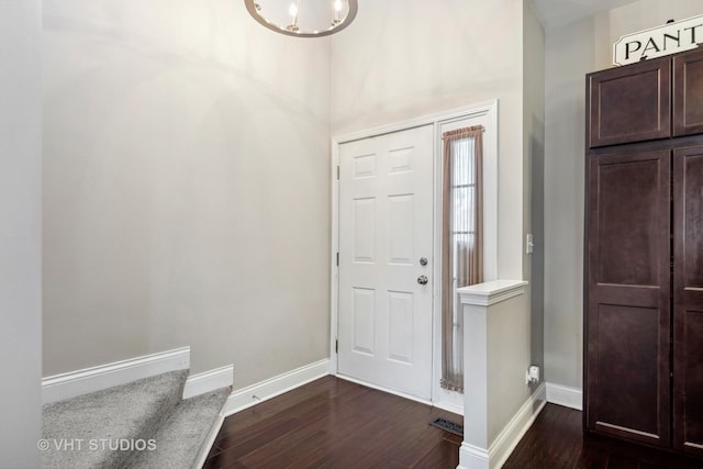 foyer entrance featuring dark hardwood / wood-style floors