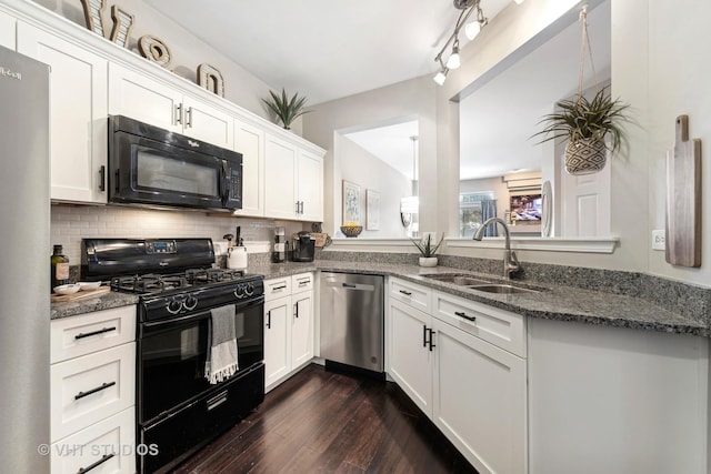 kitchen featuring dark hardwood / wood-style floors, tasteful backsplash, white cabinetry, sink, and black appliances