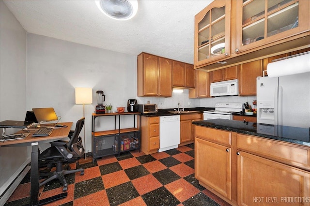 kitchen with sink, white appliances, a textured ceiling, and decorative backsplash