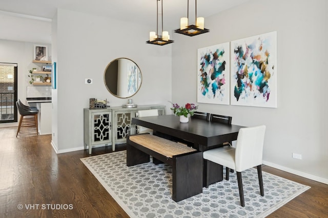 dining room with dark wood-type flooring