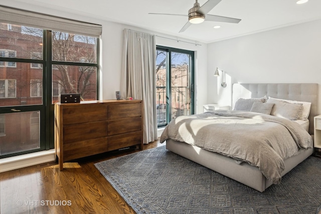 bedroom with ceiling fan, dark hardwood / wood-style flooring, and access to outside