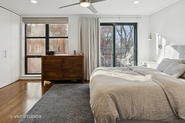 bedroom featuring ceiling fan and dark hardwood / wood-style floors