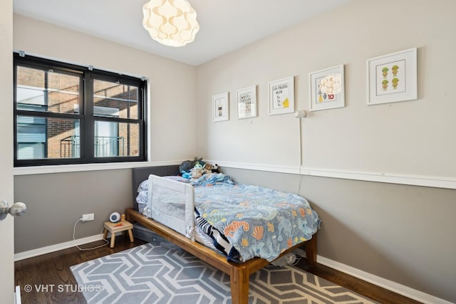 bedroom featuring dark hardwood / wood-style floors