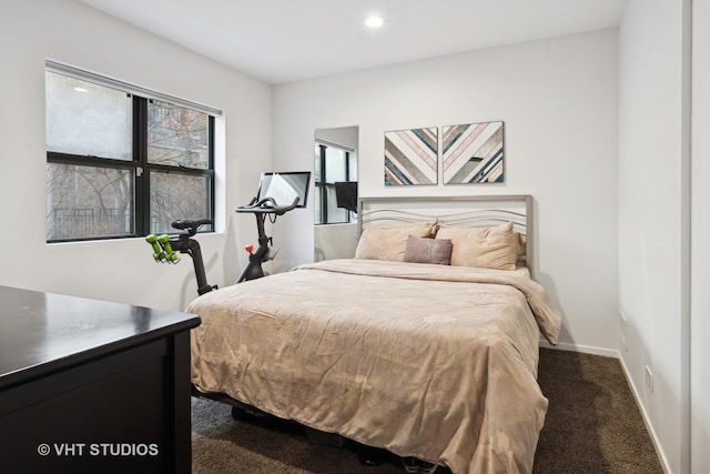 bedroom featuring dark colored carpet