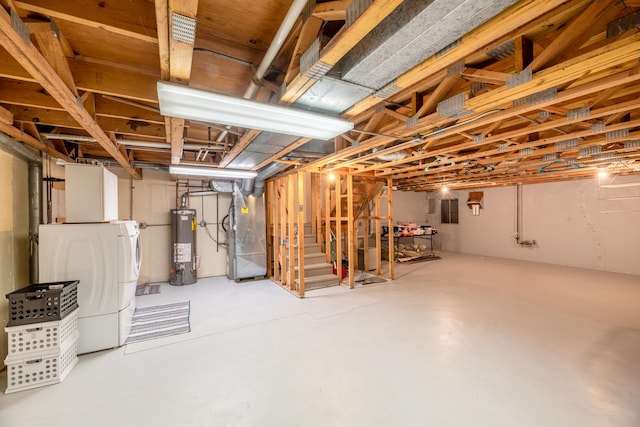 basement with heating unit, washer / clothes dryer, and gas water heater