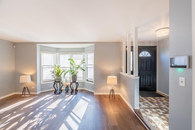 entryway with dark hardwood / wood-style floors