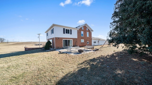 back of house with a yard and a patio area