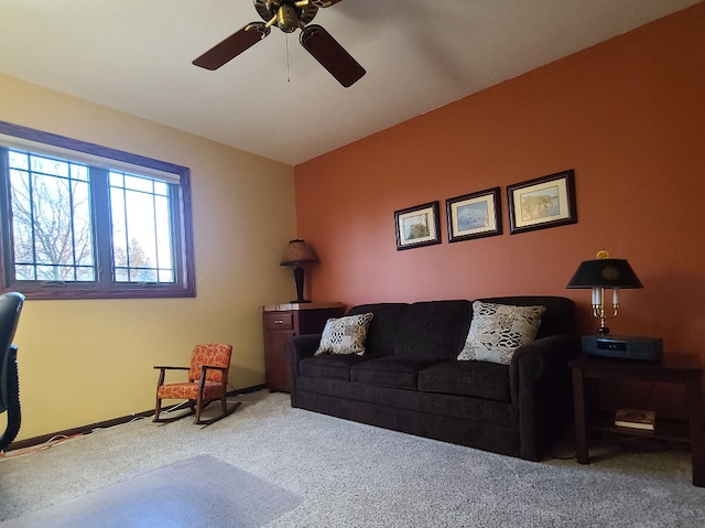 living room with ceiling fan and carpet