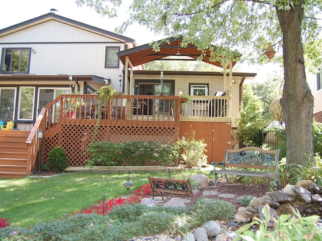 rear view of property with a deck