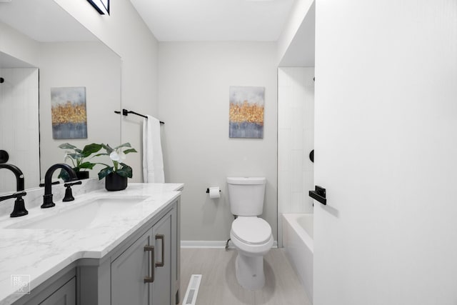 full bathroom featuring toilet, vanity, and bathing tub / shower combination