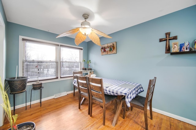 dining room featuring ceiling fan and light hardwood / wood-style floors