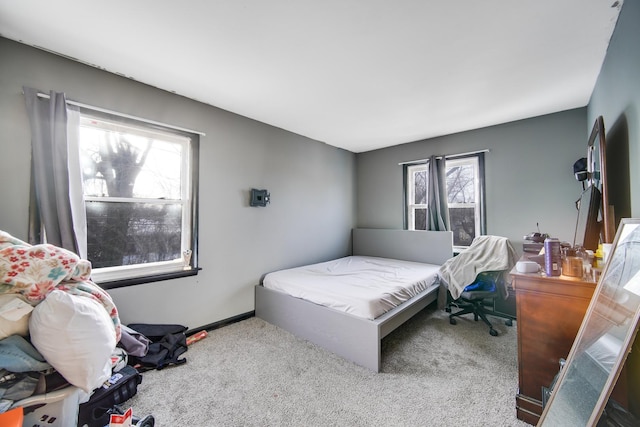 bedroom with light carpet