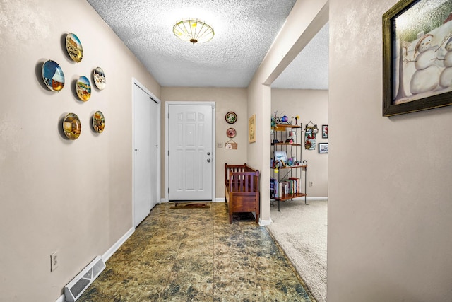 interior space with a textured ceiling