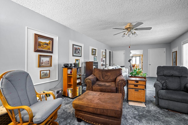 carpeted living room featuring a healthy amount of sunlight, a textured ceiling, and ceiling fan