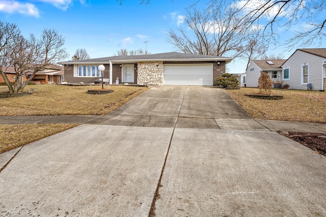 ranch-style house featuring a garage and a front lawn