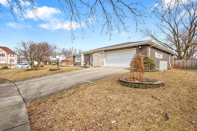 view of front facade with a garage and a front lawn