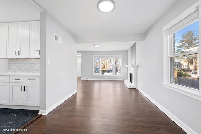 hallway featuring dark hardwood / wood-style flooring