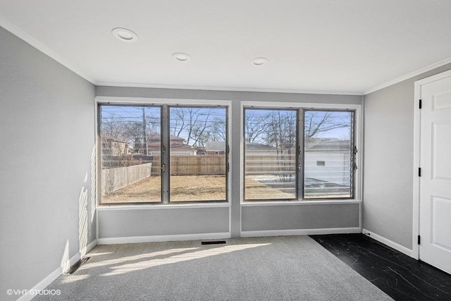 spare room with crown molding