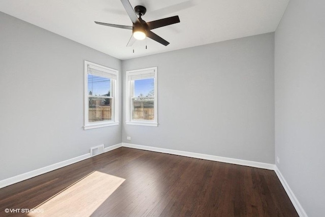 unfurnished room featuring ceiling fan and dark hardwood / wood-style floors