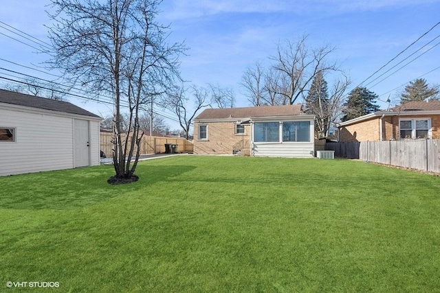 rear view of property featuring a yard