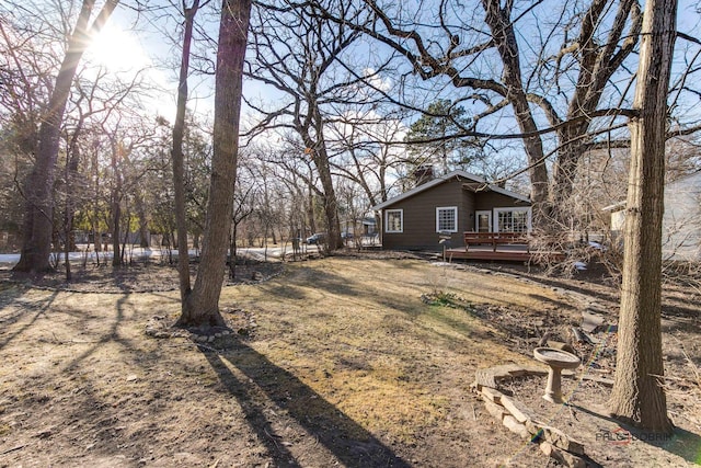 view of yard with a wooden deck