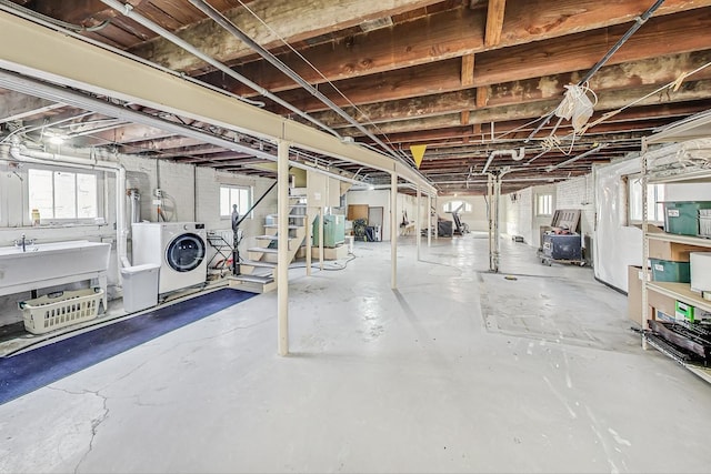 basement with washing machine and clothes dryer