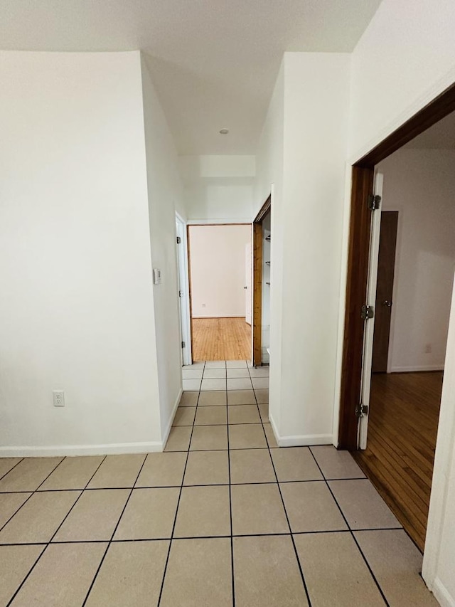 hallway with light tile patterned flooring