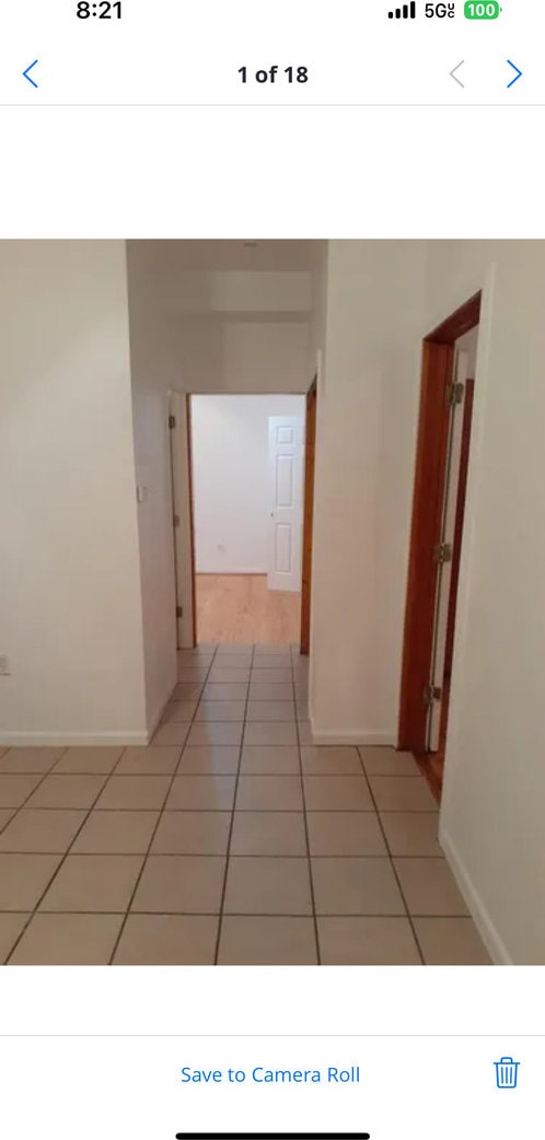 corridor with light tile patterned floors